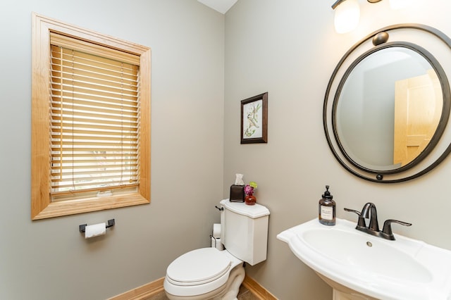2292 Teakwood Ln SW, Rochester, MN 55902 - bathroom with a sink, baseboards, and toilet