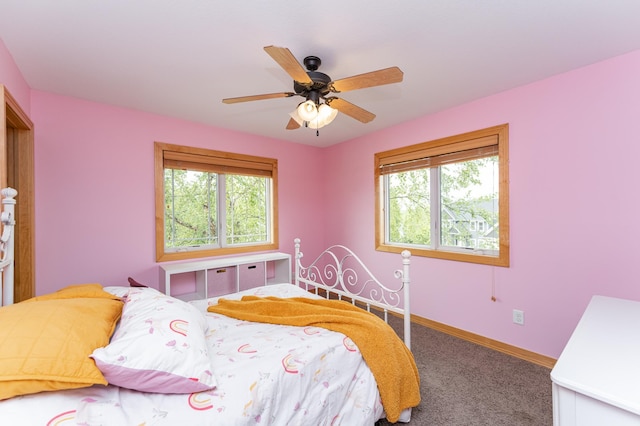 2292 Teakwood Ln SW, Rochester, MN 55902 - bedroom featuring multiple windows, carpet flooring, baseboards, and ceiling fan