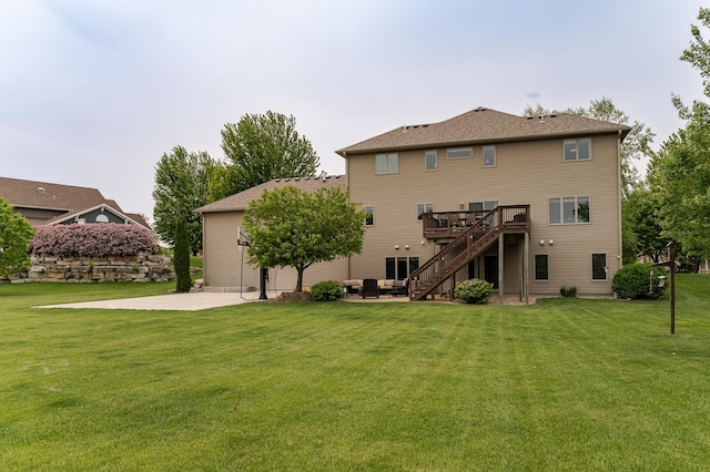 2292 Teakwood Ln SW, Rochester, MN 55902 - back of house with stairs, a patio area, a wooden deck, and a lawn