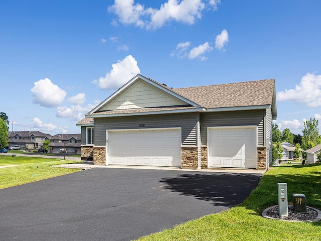 1308 Timber Ln, Buffalo, MN 55313 - view of front of home featuring stone siding, driveway, a front lawn, a garage, and a shingled roof