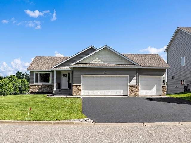 1308 Timber Ln, Buffalo, MN 55313 - craftsman-style house featuring stone siding, an attached garage, asphalt driveway, and a front yard