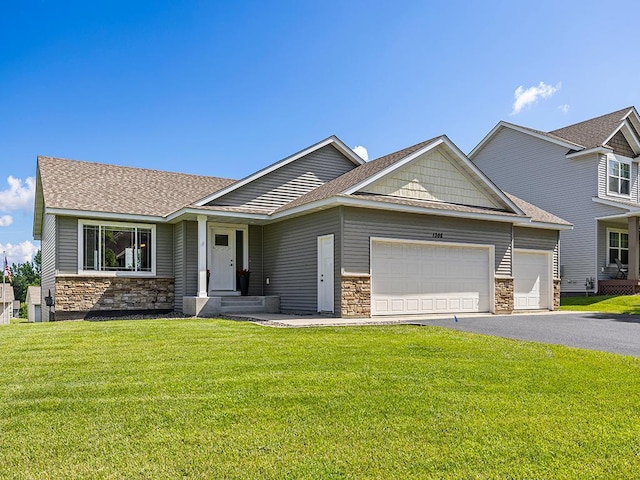 1308 Timber Ln, Buffalo, MN 55313 - view of front of home featuring stone siding, a garage, driveway, and a front yard