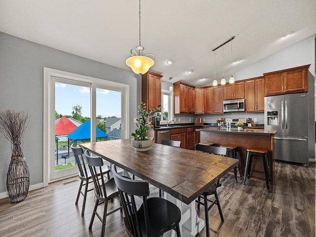 1308 Timber Ln, Buffalo, MN 55313 - dining space with lofted ceiling and dark wood-type flooring