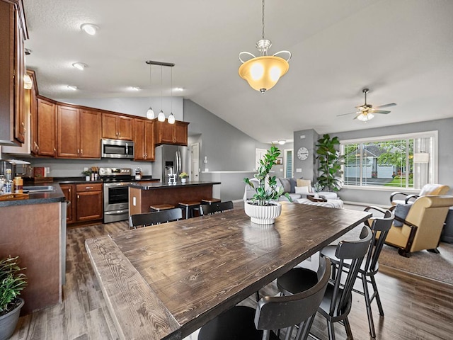 1308 Timber Ln, Buffalo, MN 55313 - dining area featuring lofted ceiling, dark wood-style floors, and ceiling fan