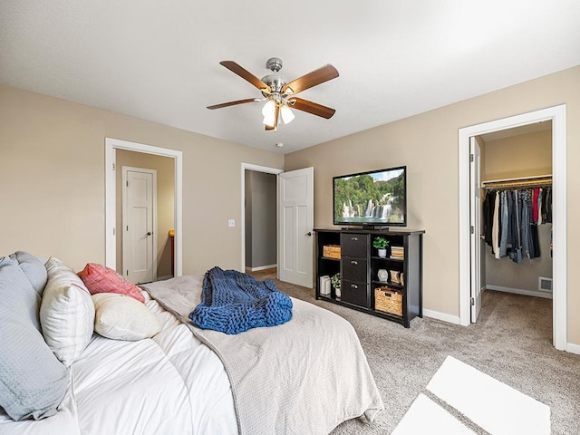 1308 Timber Ln, Buffalo, MN 55313 - bedroom with light carpet, a walk in closet, and ceiling fan