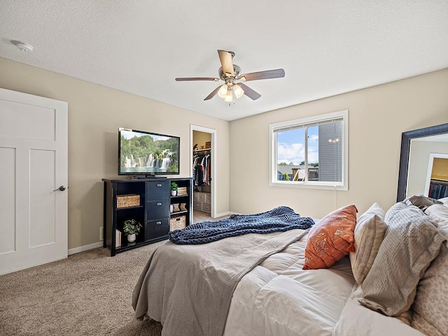 1308 Timber Ln, Buffalo, MN 55313 - bedroom with light carpet, a walk in closet, and a ceiling fan