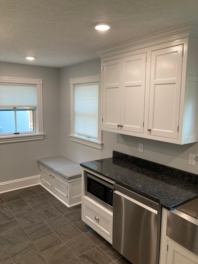 112 Harriet St S, Stillwater, MN 55082 - kitchen featuring appliances with stainless steel finishes, white cabinetry, baseboards, recessed lighting, and dark stone counters