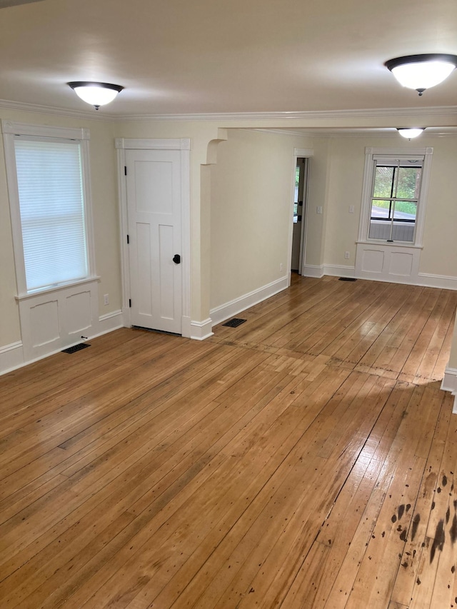 112 Harriet St S, Stillwater, MN 55082 - spare room featuring light wood-type flooring, ornamental molding, and baseboards