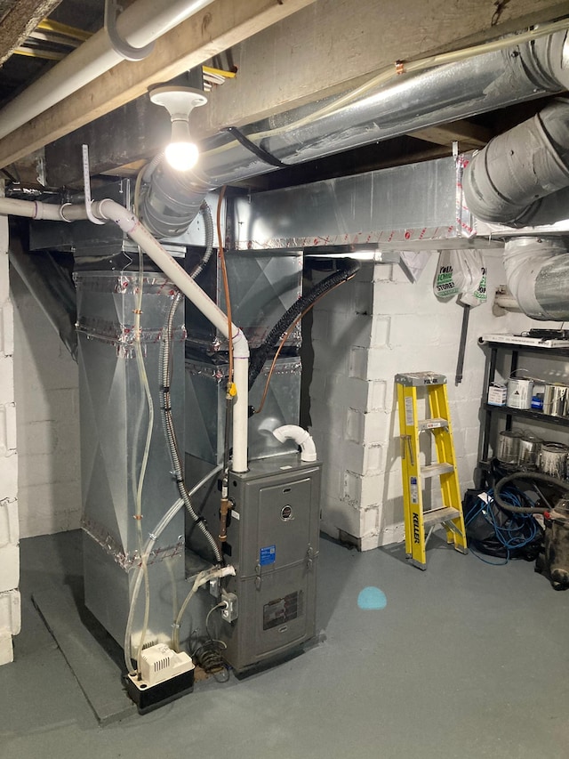 112 Harriet St S, Stillwater, MN 55082 - unfinished below grade area featuring heating unit and concrete block wall