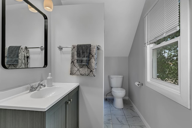 607 23rd Ave N, Saint Cloud, MN 56303 - bathroom with marble finish floors, toilet, vanity, and baseboards