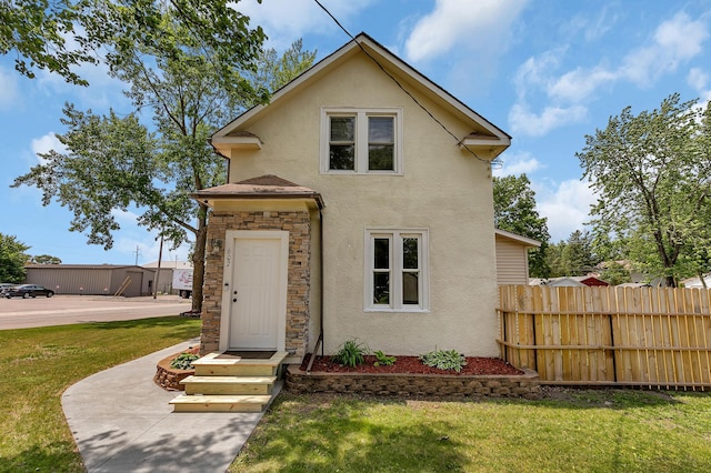 607 23rd Ave N, Saint Cloud, MN 56303 - view of front of home featuring stucco siding and stone siding