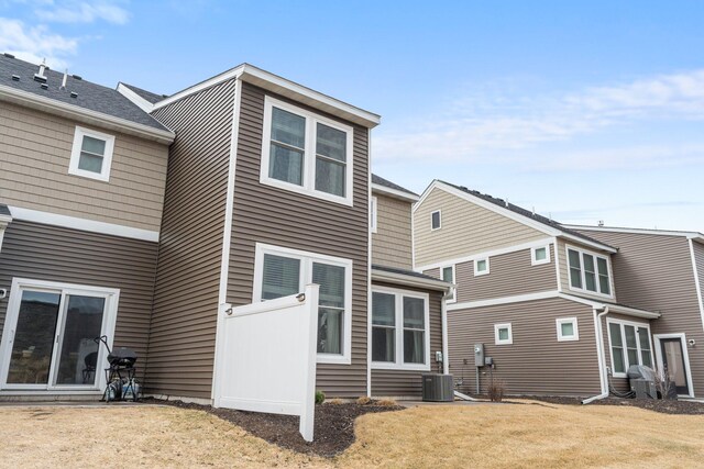 5322 94th Ln N, Brooklyn Park, MN 55443 - back of property with a lawn and cooling unit