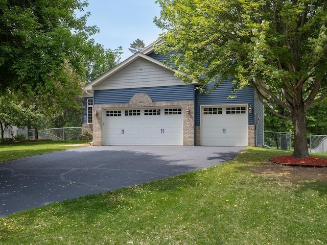 15564 Vale St NW, Andover, MN 55304 - view of front of home with asphalt driveway and a garage