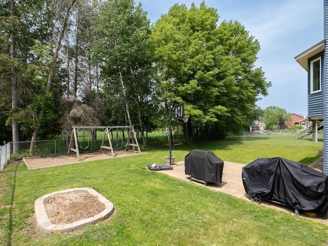 15564 Vale St NW, Andover, MN 55304 - view of yard featuring a playground, a patio, and view of scattered trees