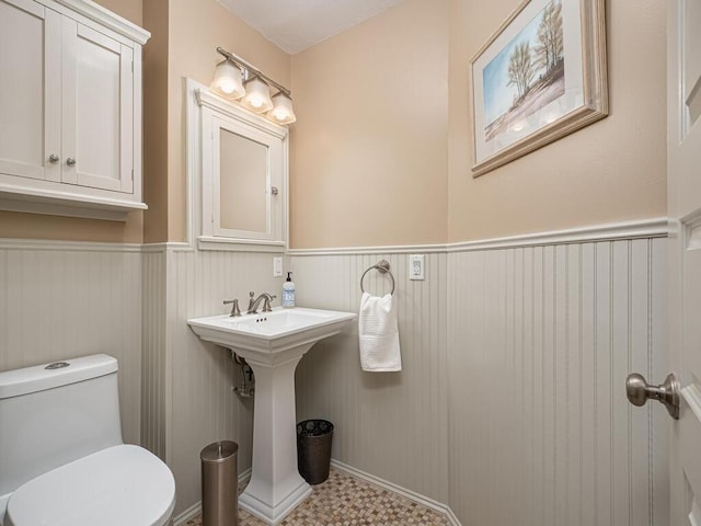 15564 Vale St NW, Andover, MN 55304 - bathroom with wainscoting and toilet