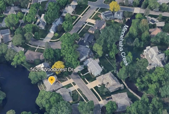 5620 Woodcrest Dr, Edina, MN 55424 - aerial view of property and surrounding area with nearby suburban area and a nearby body of water