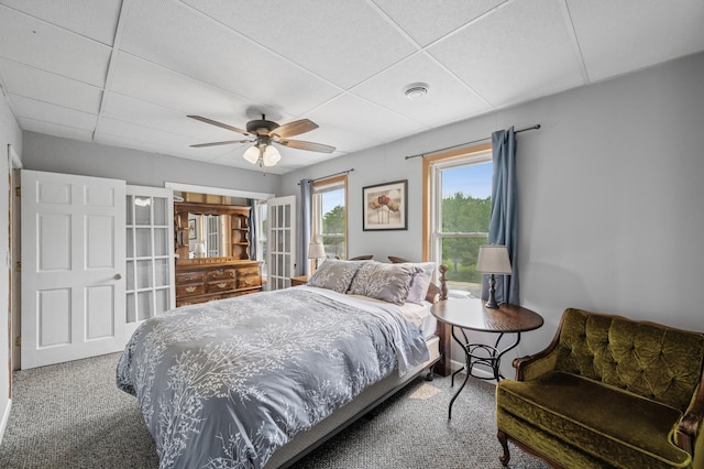 631 Bench St, Taylors Falls, MN 55084 - carpeted bedroom with a paneled ceiling and a ceiling fan