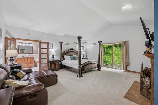 631 Bench St, Taylors Falls, MN 55084 - carpeted bedroom featuring lofted ceiling, ensuite bathroom, and a textured ceiling