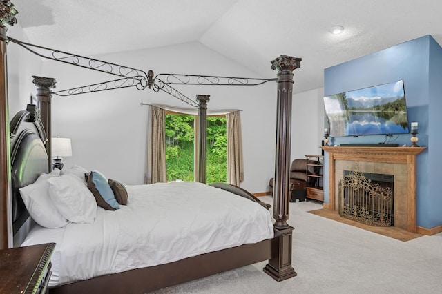 631 Bench St, Taylors Falls, MN 55084 - bedroom featuring carpet floors, lofted ceiling, and a fireplace