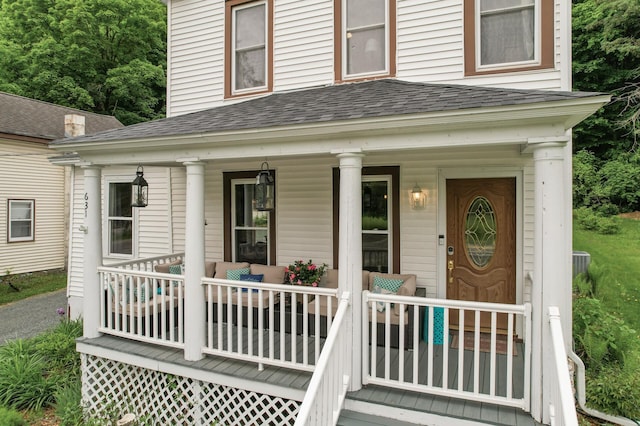 631 Bench St, Taylors Falls, MN 55084 - view of exterior entry with roof with shingles and covered porch