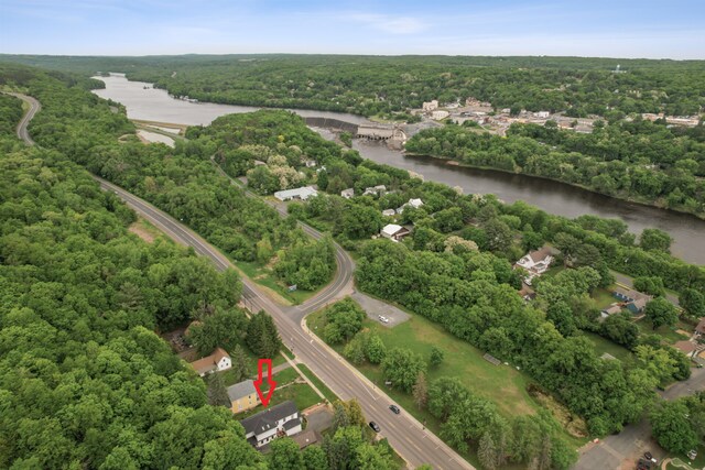 631 Bench St, Taylors Falls, MN 55084 - aerial view of property's location with a heavily wooded area and a large body of water