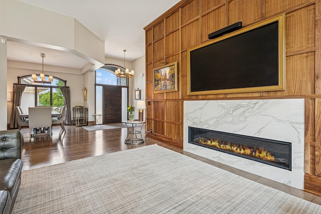 11883 Flanders Cir NE, Blaine, MN 55449 - living room with a chandelier, a fireplace, and wood finished floors
