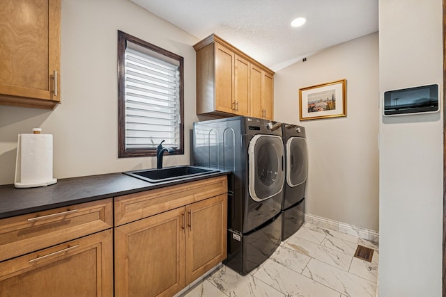 11883 Flanders Cir NE, Blaine, MN 55449 - laundry room featuring washer and clothes dryer, light marble finish flooring, cabinet space, and recessed lighting
