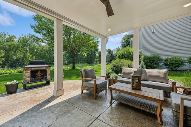 11883 Flanders Cir NE, Blaine, MN 55449 - view of patio / terrace with an outdoor living space with a fireplace, ceiling fan, and view of scattered trees
