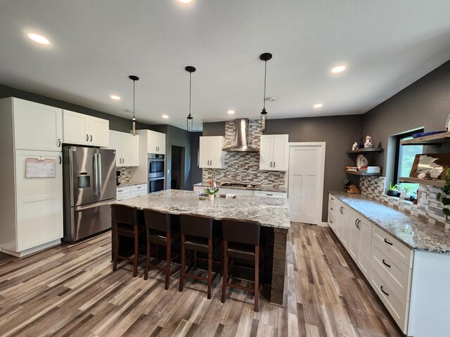 26575 US-71, Arago Twp, MN 56470 - kitchen featuring appliances with stainless steel finishes, wall chimney exhaust hood, open shelves, backsplash, and recessed lighting