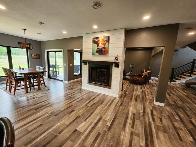 26575 US-71, Arago Twp, MN 56470 - living room with wood finished floors, recessed lighting, a fireplace, stairway, and baseboards