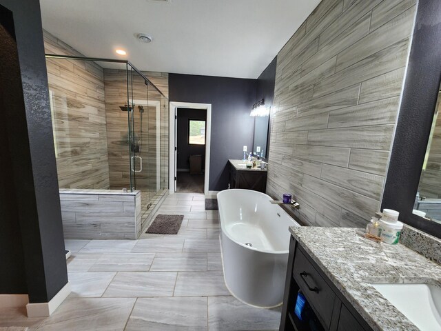 26575 US-71, Arago Twp, MN 56470 - full bath with a stall shower, two vanities, a freestanding bath, and baseboards