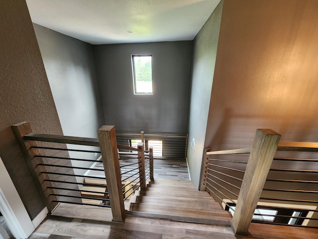 26575 US-71, Arago Twp, MN 56470 - stairway featuring a textured wall, wood finished floors, and baseboards