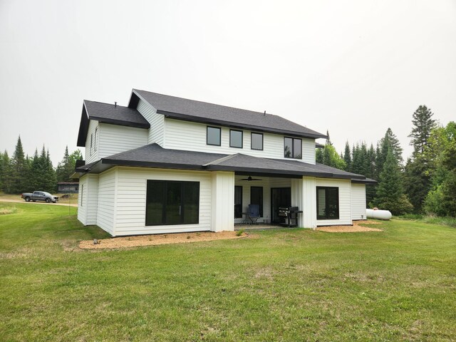 26575 US-71, Arago Twp, MN 56470 - back of property with a ceiling fan and a yard