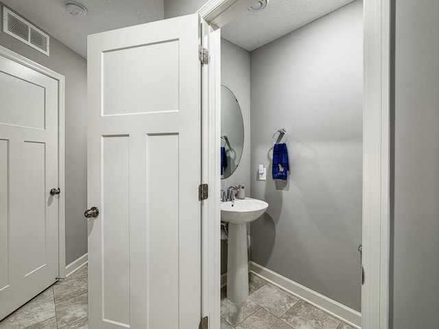 1211 Lower 143rd St E, Rosemount, MN 55068 - bathroom featuring baseboards