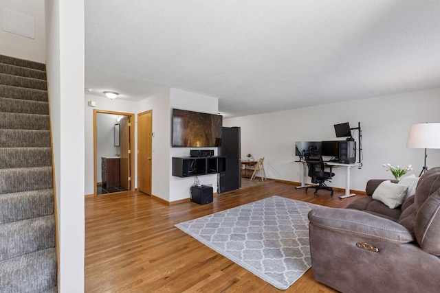 2517 Cobble Hill Ct Unit I, Woodbury, MN 55125 - living area featuring stairs, wood finished floors, and baseboards
