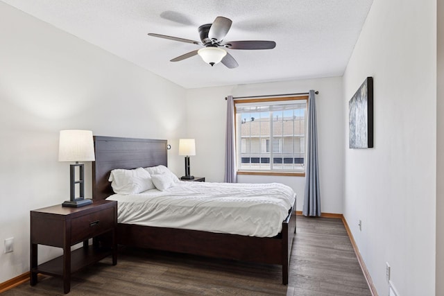 2517 Cobble Hill Ct Unit I, Woodbury, MN 55125 - bedroom featuring dark wood-type flooring, baseboards, a ceiling fan, and a textured ceiling