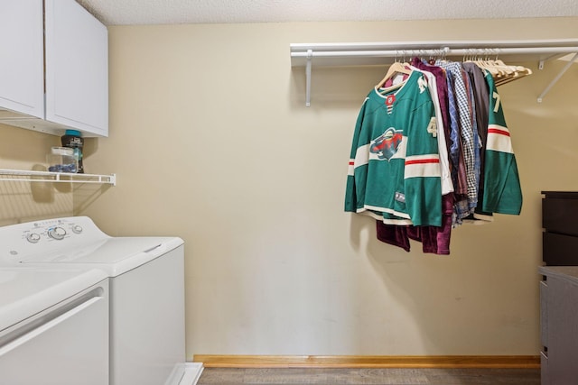 2517 Cobble Hill Ct Unit I, Woodbury, MN 55125 - laundry room with washer and dryer, cabinet space, and wood finished floors