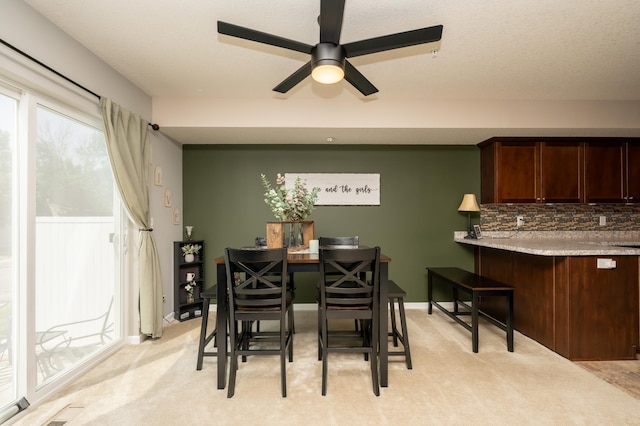 201 Chandler Ct, Jordan, MN 55352 - dining space featuring a ceiling fan and light carpet