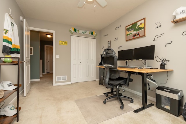 201 Chandler Ct, Jordan, MN 55352 - home office featuring light carpet, ceiling fan, and baseboards