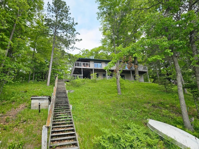24429 Camp Lake Rd, Garrison, MN 56401 - view of yard featuring stairway and a deck