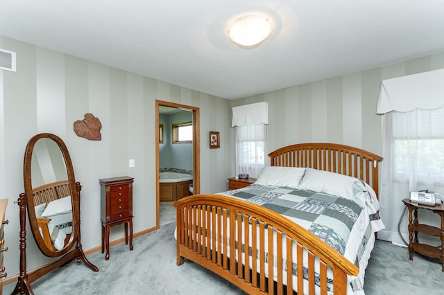 1218 6th St NW, Dodge Center, MN 55927 - bedroom with light carpet, wallpapered walls, and baseboards