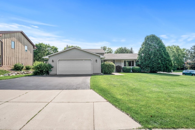 1902 Duck Pond Dr W, Saint Paul, MN 55118 - view of front of home featuring a front lawn, an attached garage, and asphalt driveway
