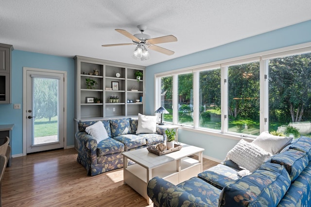 1902 Duck Pond Dr W, Saint Paul, MN 55118 - living room featuring a ceiling fan, wood finished floors, and a textured ceiling