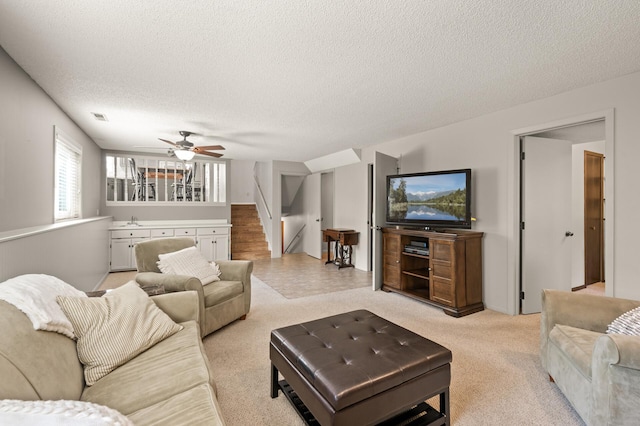 1902 Duck Pond Dr W, Saint Paul, MN 55118 - living room featuring a textured ceiling, stairway, and ceiling fan