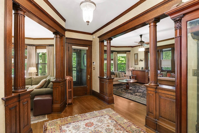 880 Fairmount Ave, Saint Paul, MN 55105 - foyer with crown molding, wood finished floors, ceiling fan, and decorative columns