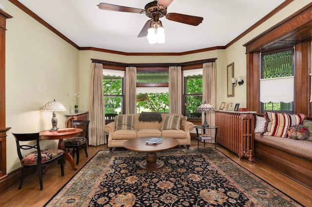 880 Fairmount Ave, Saint Paul, MN 55105 - living area featuring wood finished floors, plenty of natural light, a ceiling fan, and crown molding