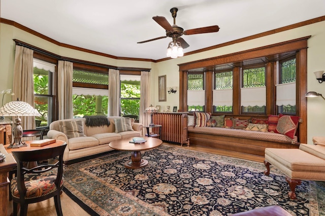 880 Fairmount Ave, Saint Paul, MN 55105 - living room with wood finished floors, a ceiling fan, and crown molding