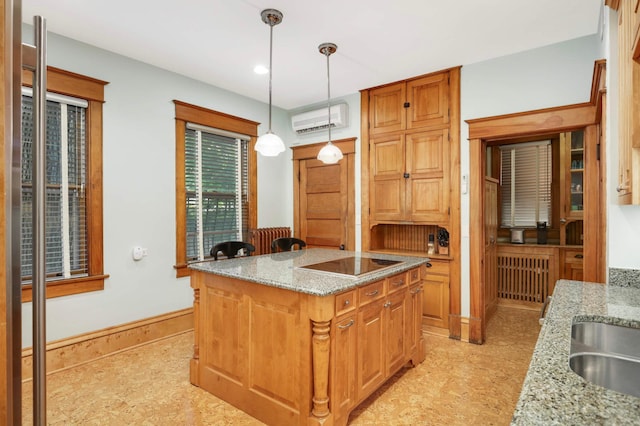 880 Fairmount Ave, Saint Paul, MN 55105 - kitchen featuring black electric cooktop, an AC wall unit, decorative light fixtures, light stone countertops, and recessed lighting