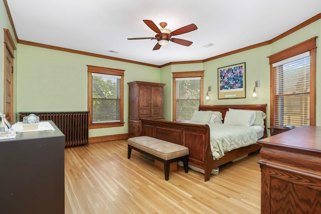 880 Fairmount Ave, Saint Paul, MN 55105 - bedroom with radiator heating unit, light wood-style floors, crown molding, and ceiling fan