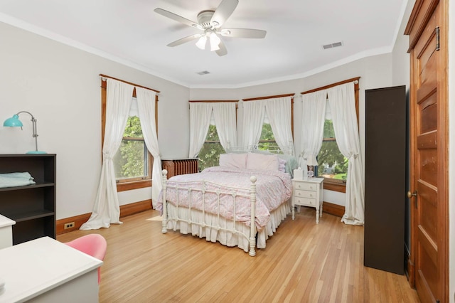 880 Fairmount Ave, Saint Paul, MN 55105 - bedroom with light wood finished floors, ornamental molding, and ceiling fan